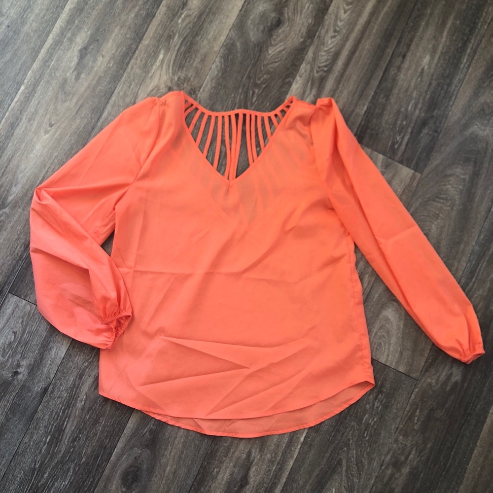 Cute orange blouse with cut-outs